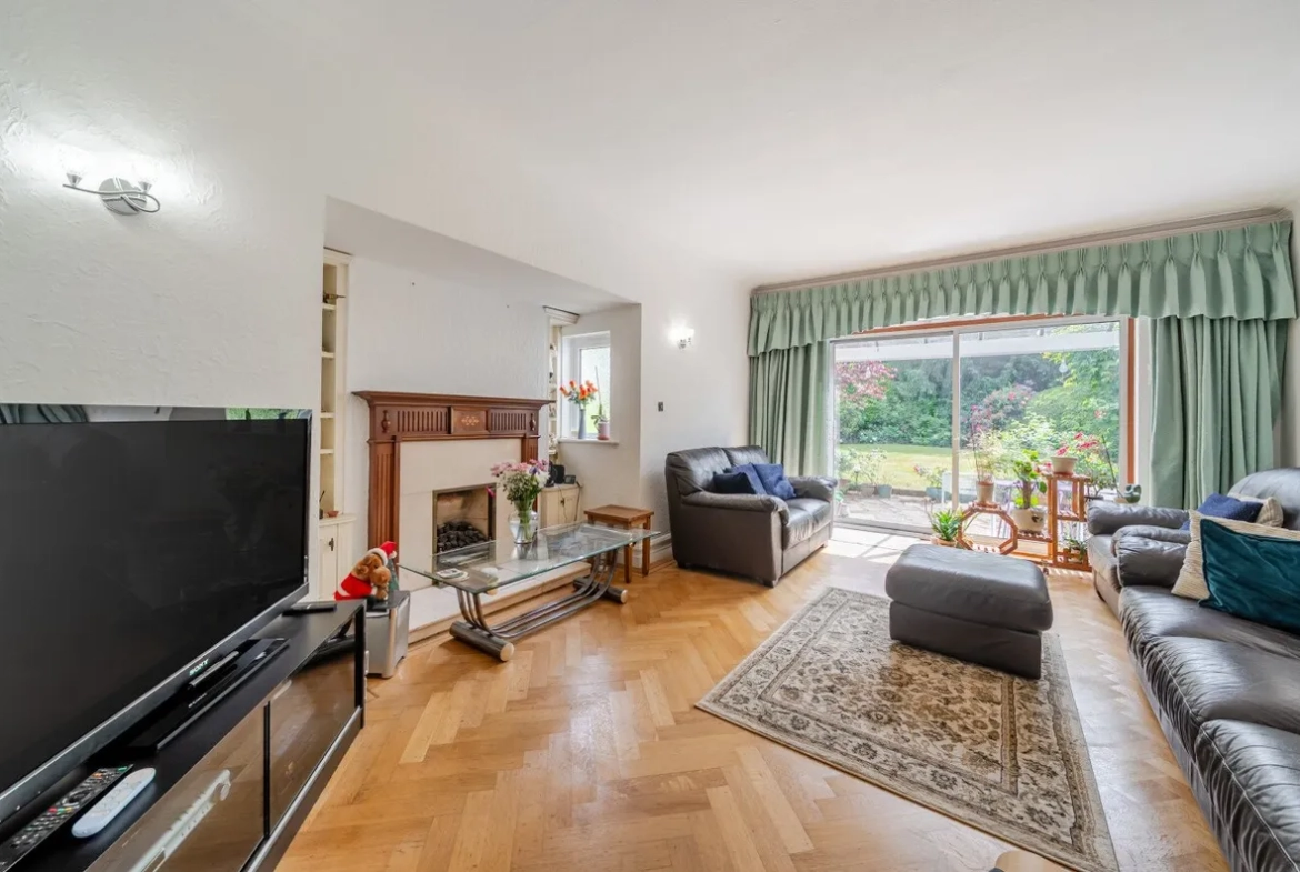 Living room with fireplace and garden view, Orpington house