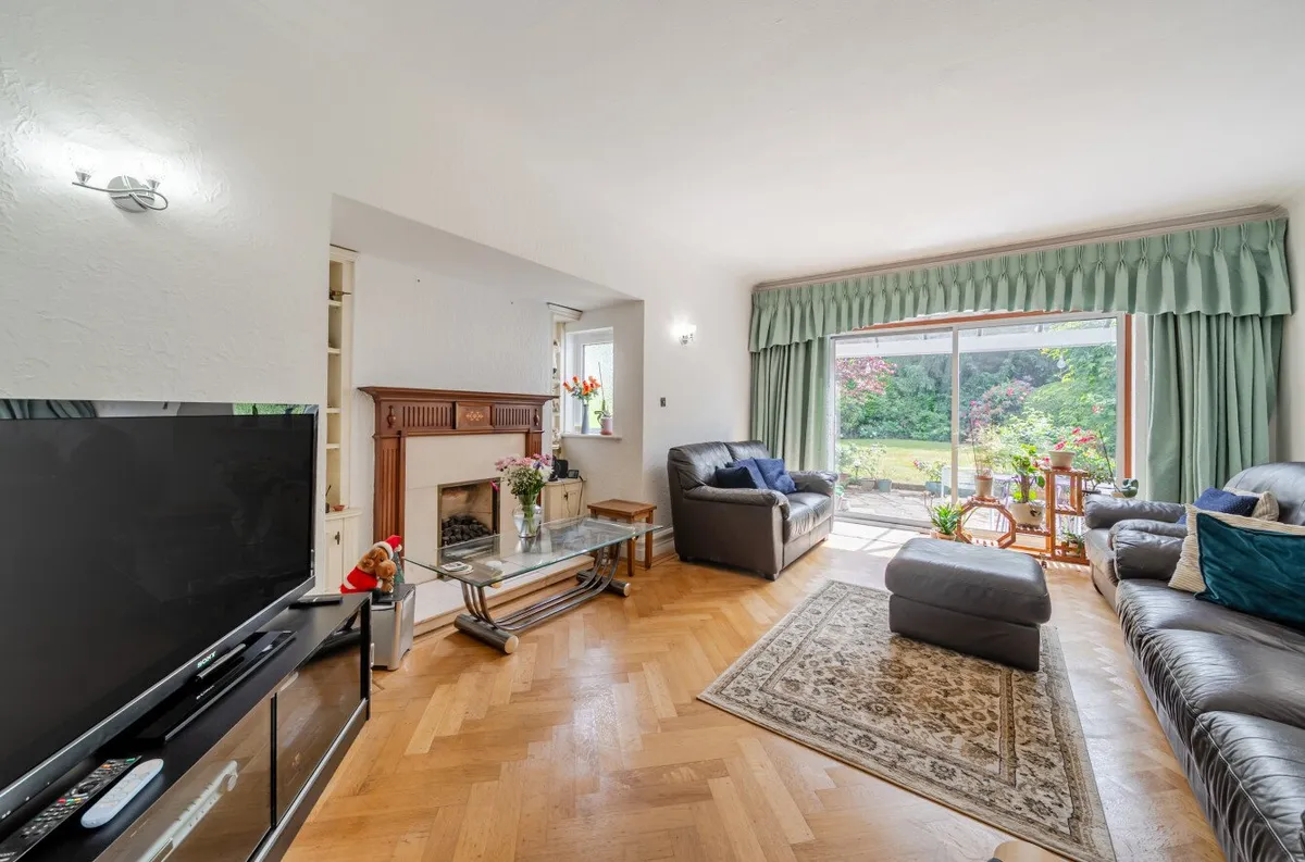 Living room with fireplace and garden view, Orpington house