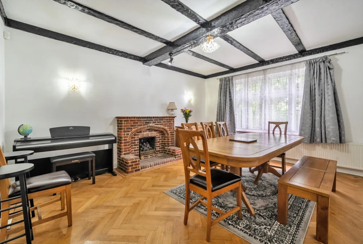 Dining room with exposed beams and fireplace, Orpington house