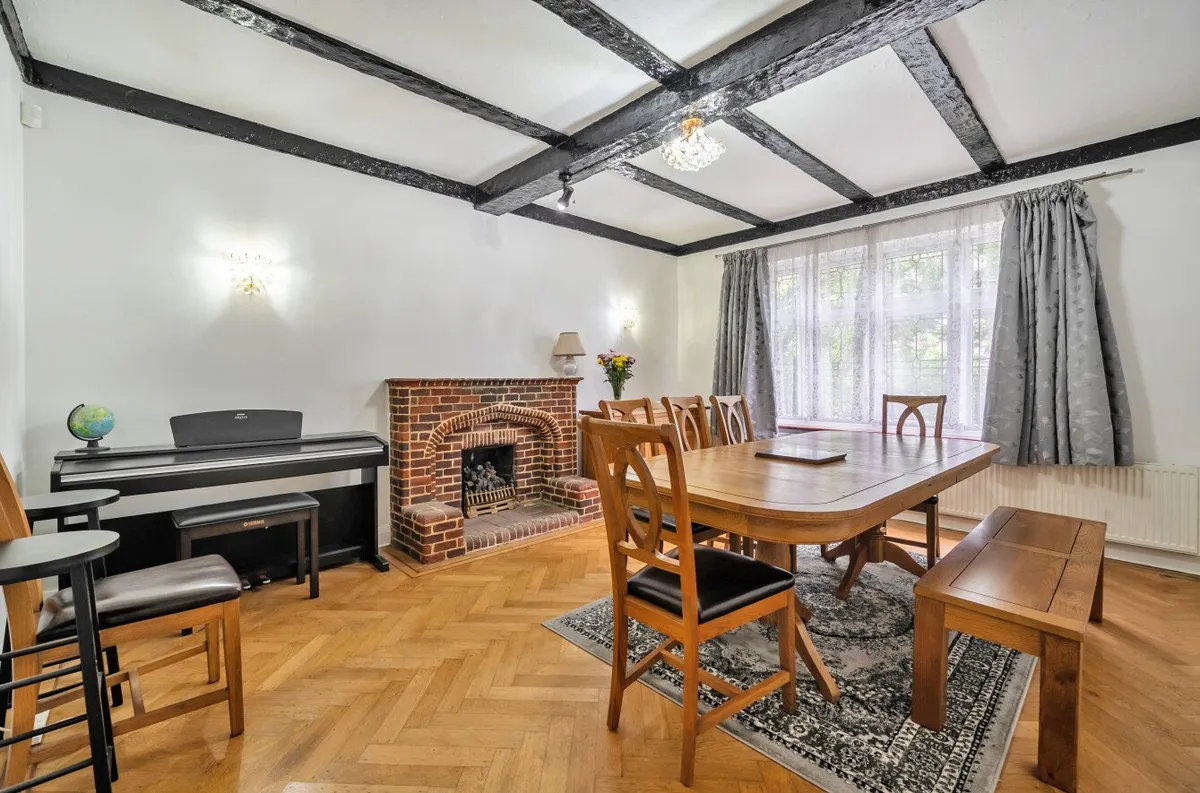 Dining room with exposed beams and fireplace, Orpington house