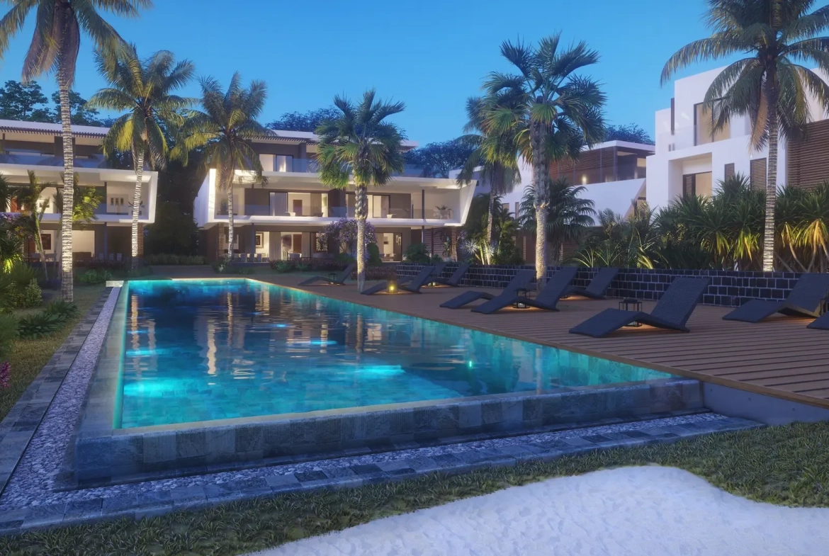 Swimming pool and residential blocks at dusk, The Peninsula Black River Mauritius (architect’s impression)