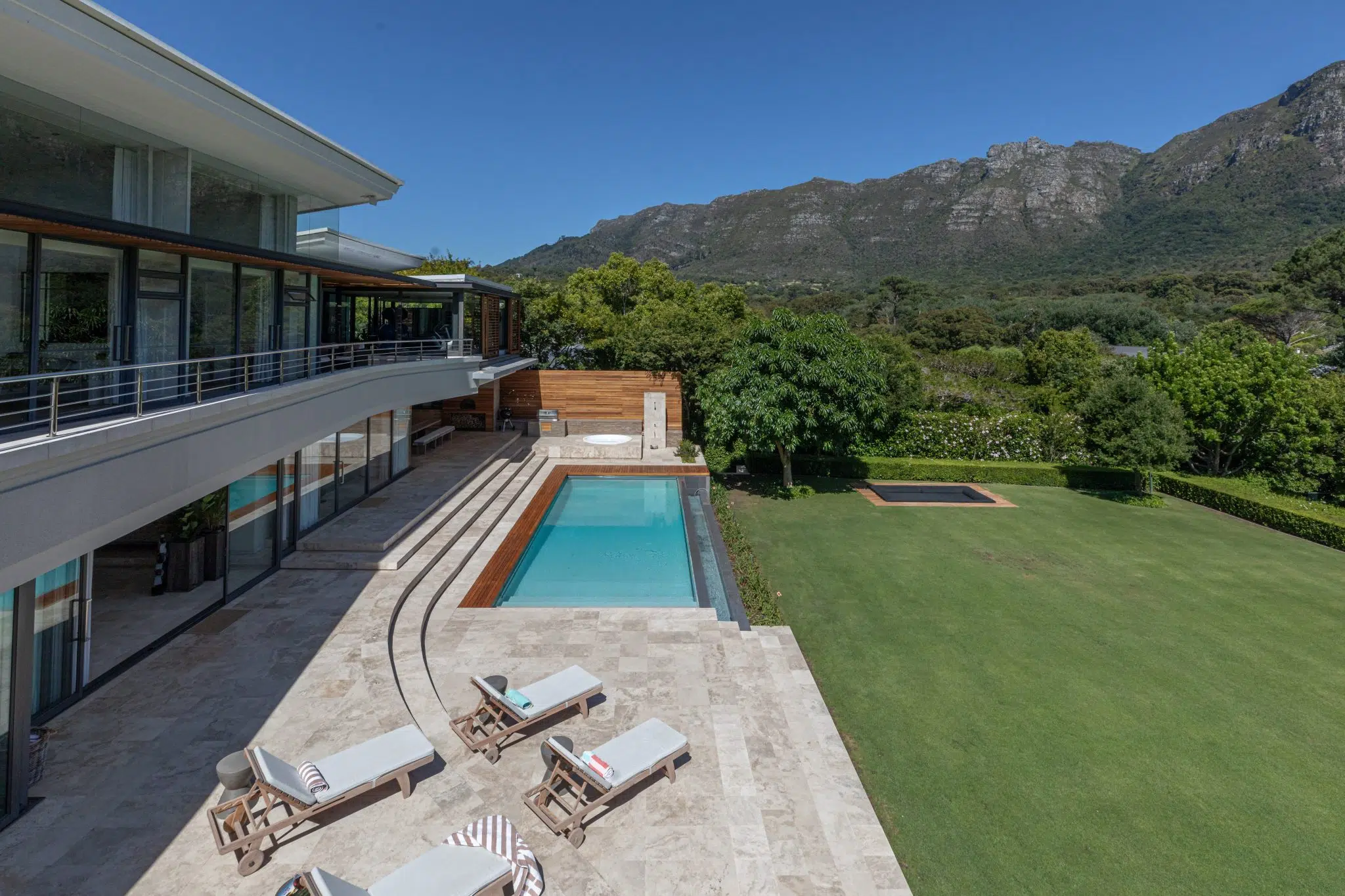 Makomo — the pool terrace and gardens beneath the mountain